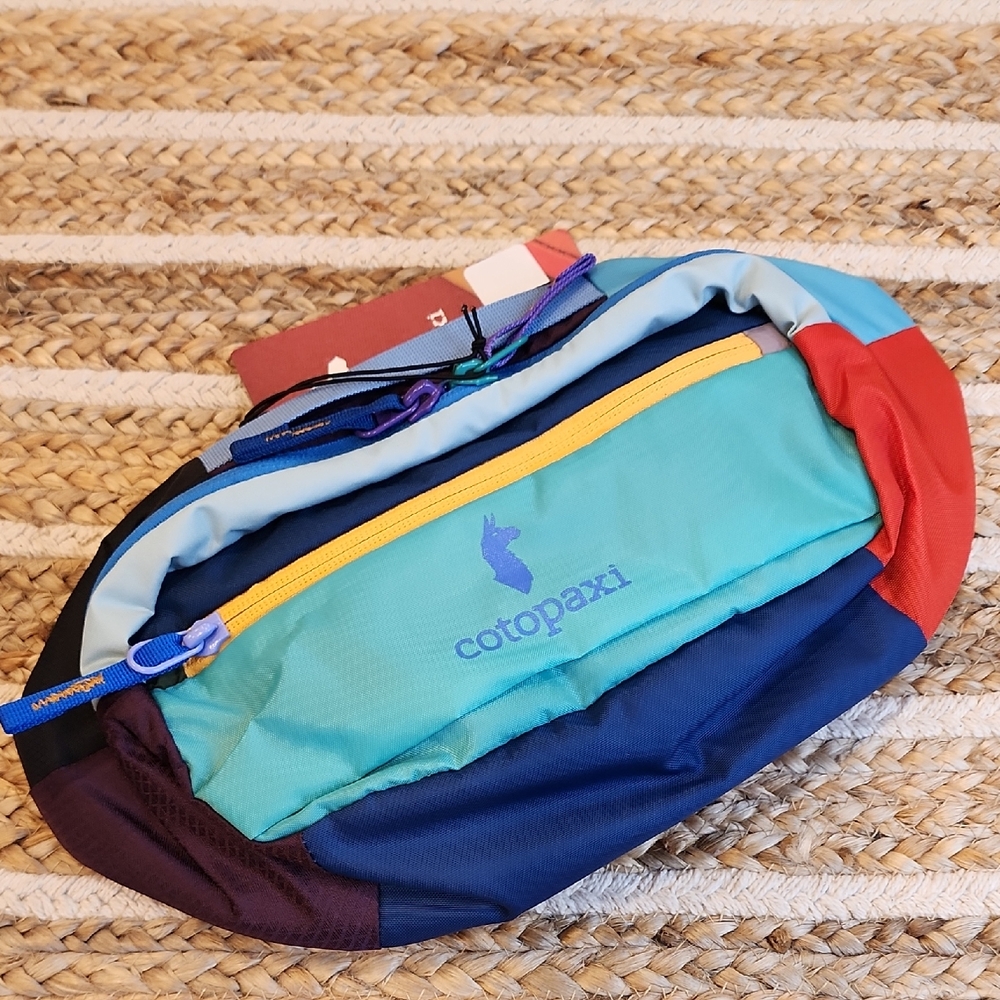 Cotopaxi Colorful Women's Backpack with Blue and Red Accents